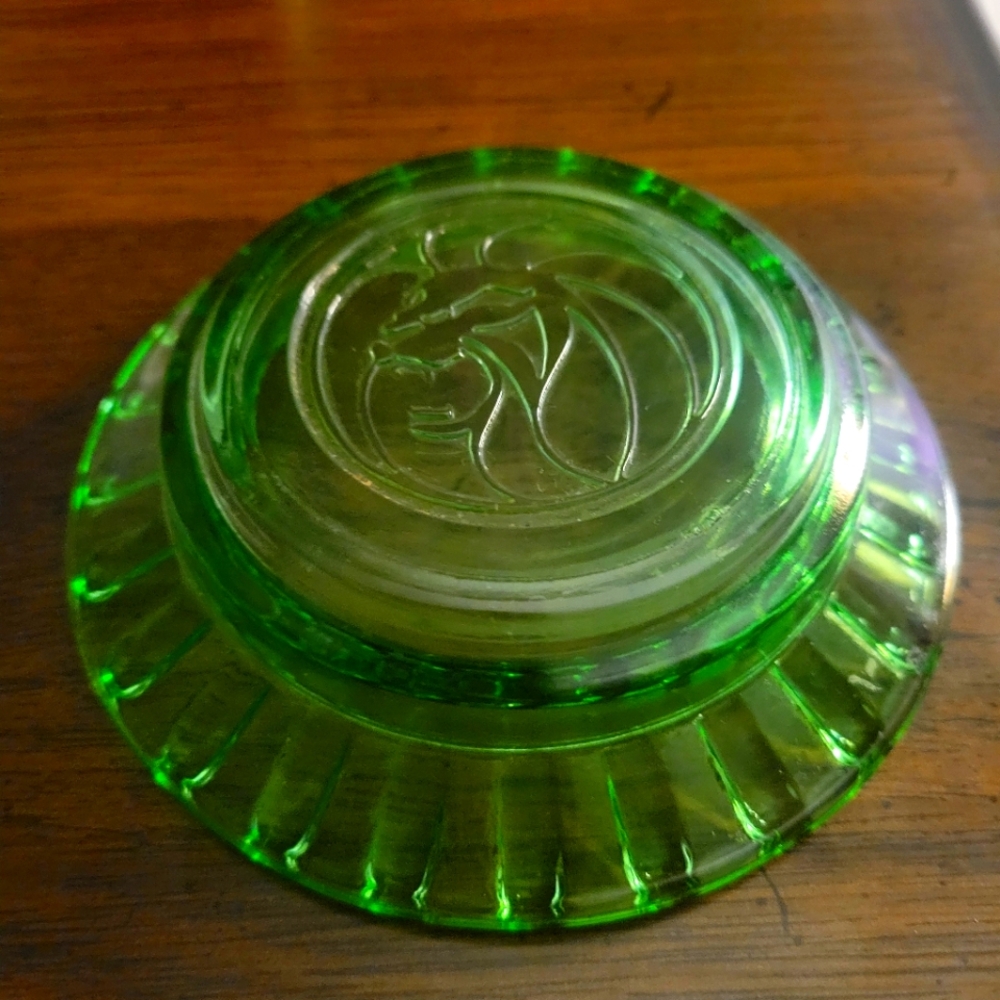 A Vintage Green Glass ashtray from the MGM Grand Hotel in Las Vegas.